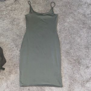 three pieces of clothing all green